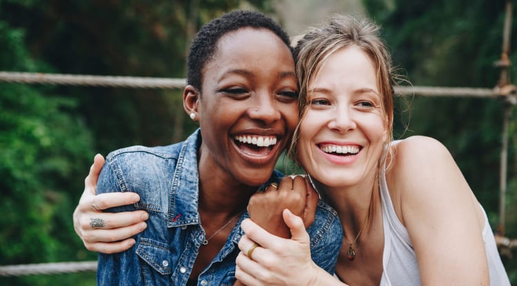 Two people smiling outside YOO on the Park in Atlanta, Georgia